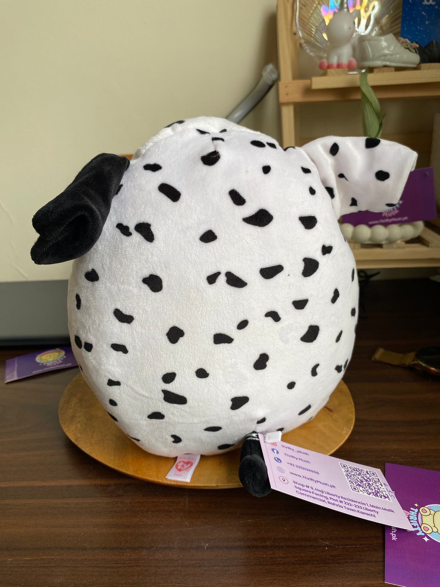 Dalmatian-themed plush toy from the Ty Squish. Fetch is a black and white Dalmatian dog with blue eyes and one black ear