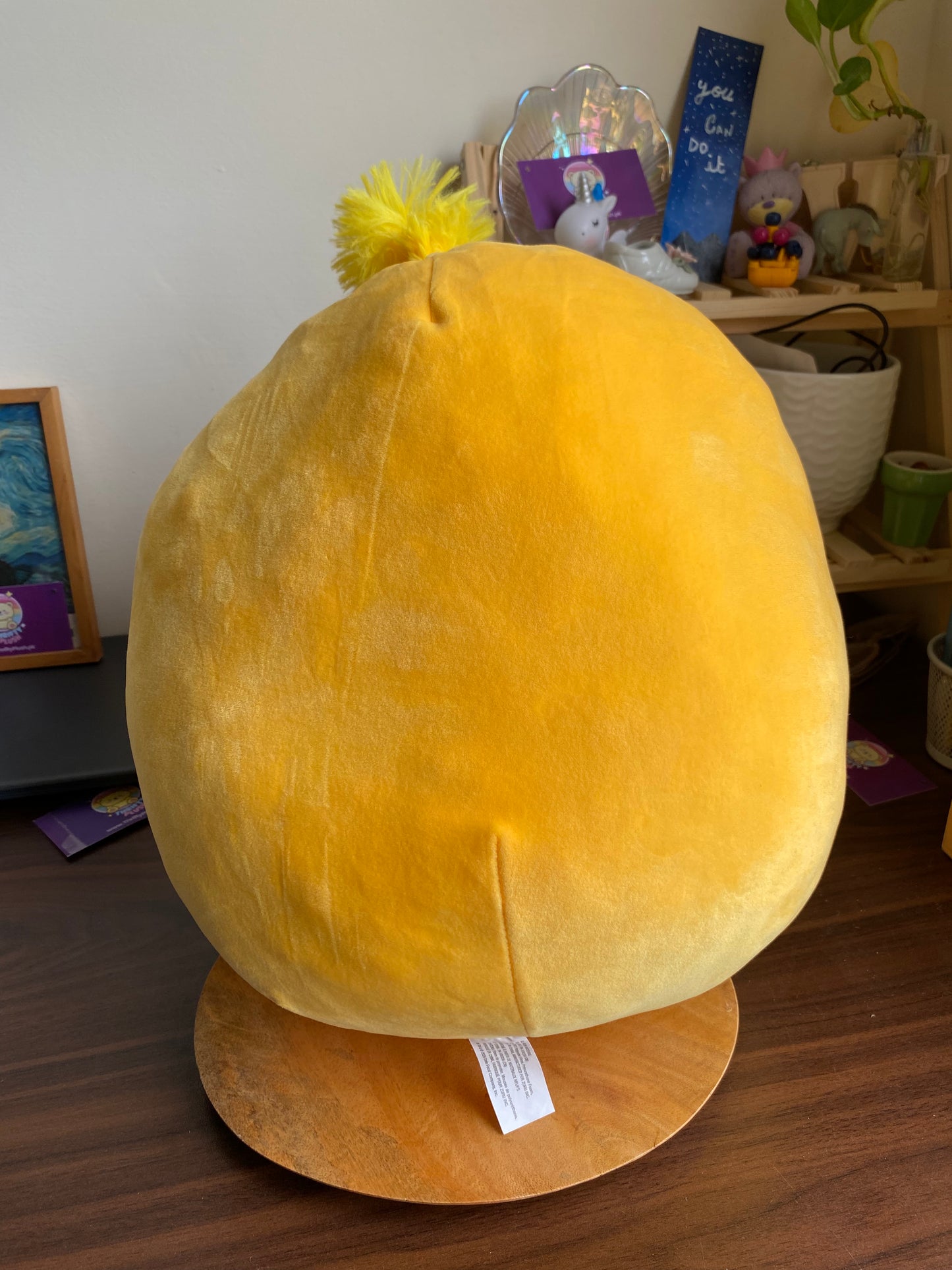 ZURU Snackles plush toy, specifically Sandy the Sloth holding a Dole Tropical Gold Pineapple