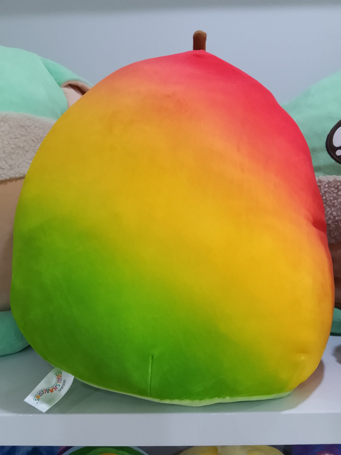Squishmallows Ximena the Mango plush toy.