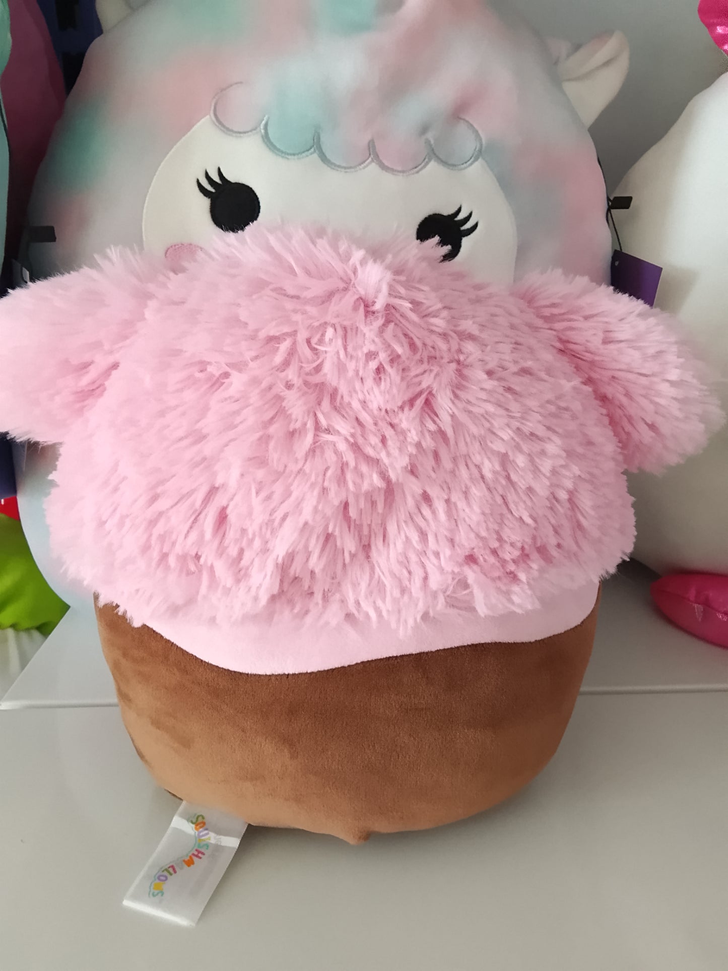 Squishmallows Brina the Chocolate Dipped Pink Bigfoot plush toy.