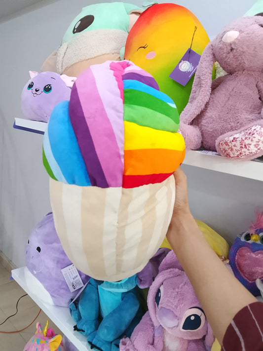 Squishmallows rainbow snow cupcake plush toy.
