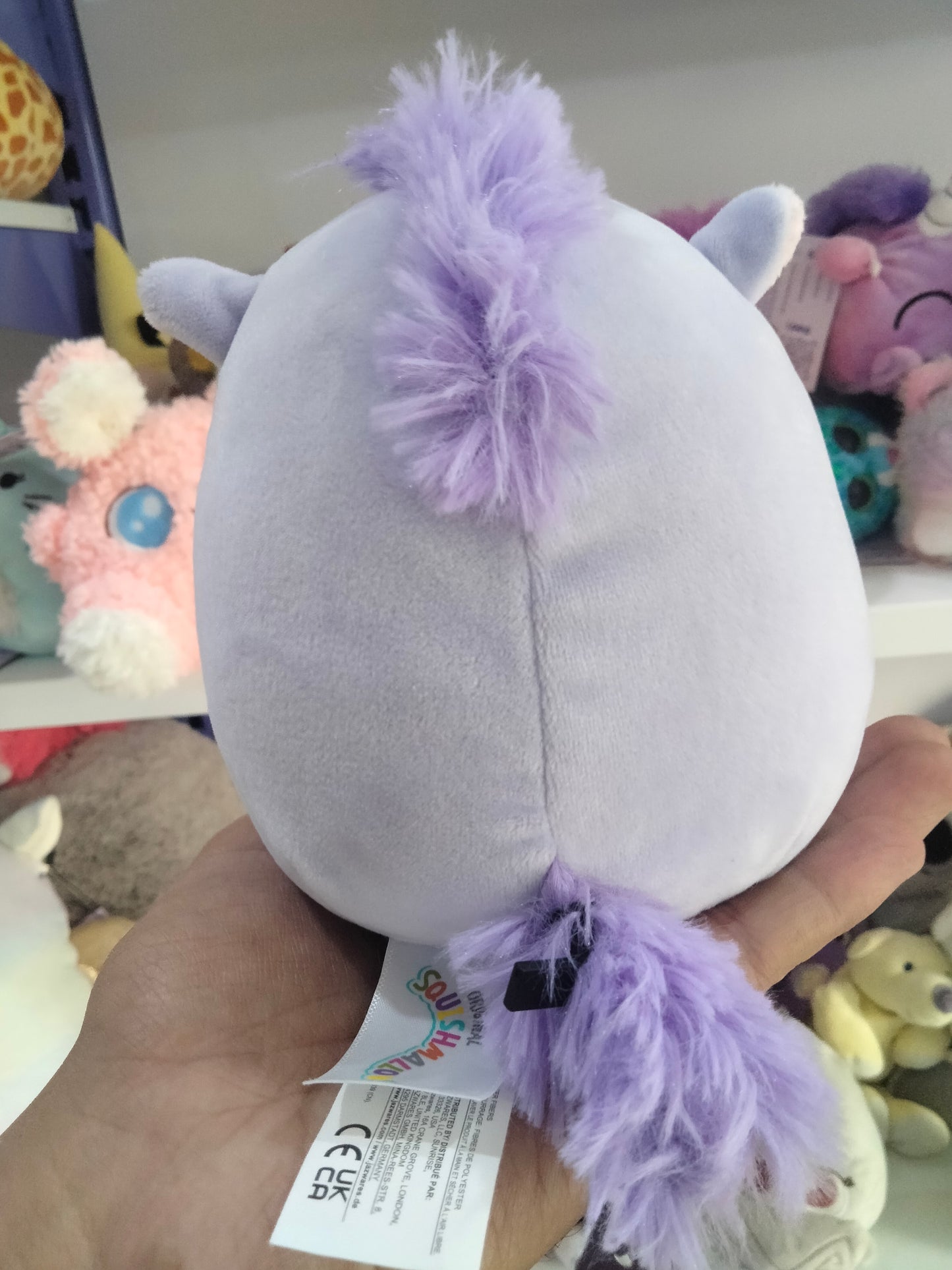 Squishmallows plush toy featuring the character Meadow, the purple horse.