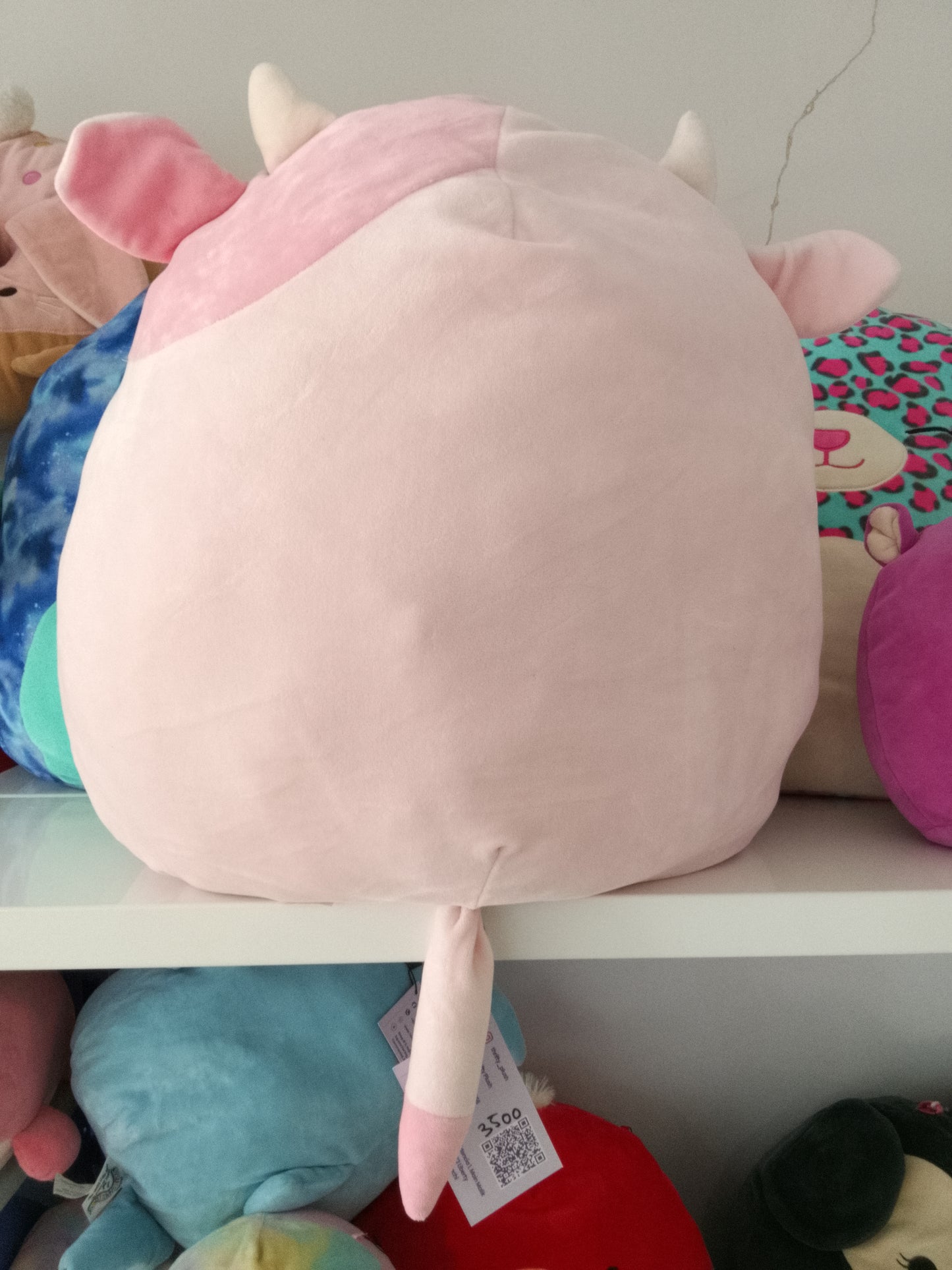 Squishmallows Clay the Pink Cow plush toy.