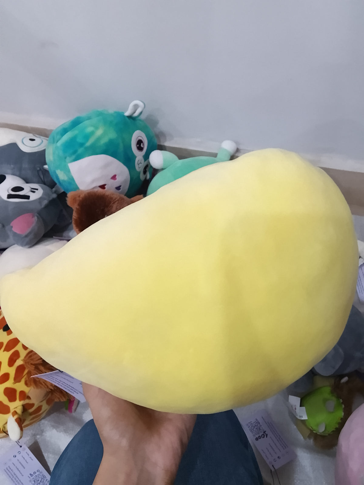 yellow Squishmallow Estelle the Chick plush toy.