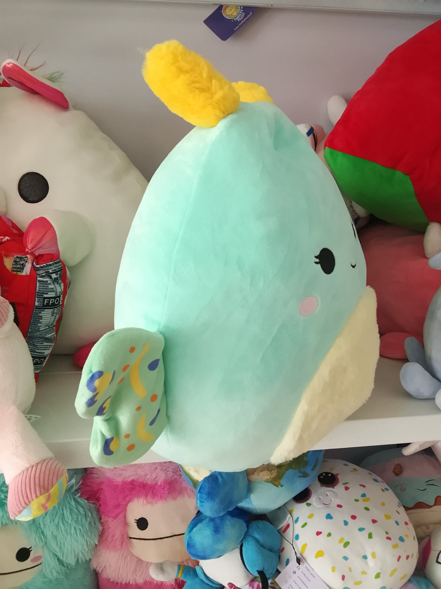 Squishmallows Connie the Emerald Moth plush toy.