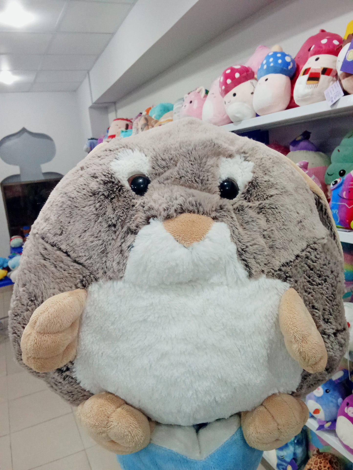 Cozy Noxxiez rabbit plush cushion hand warmer.