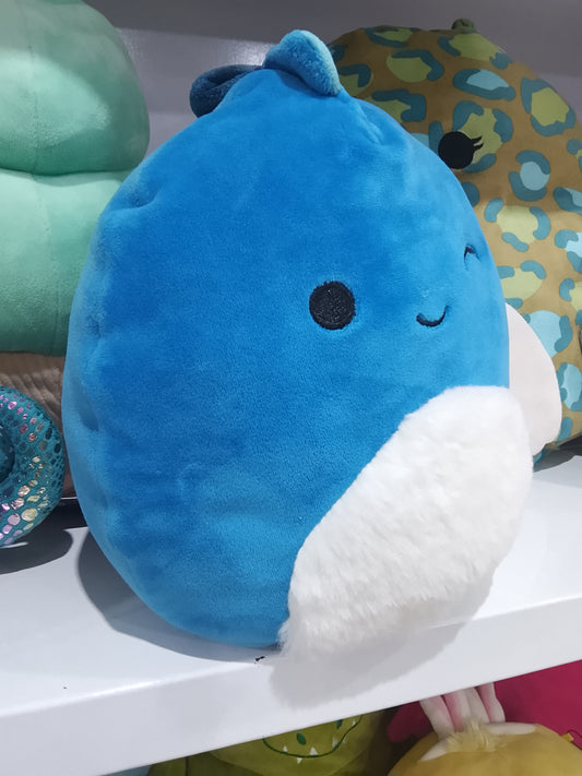 Squishmallows Brody, a blue winking dinosaur with a fuzzy white belly plush toy