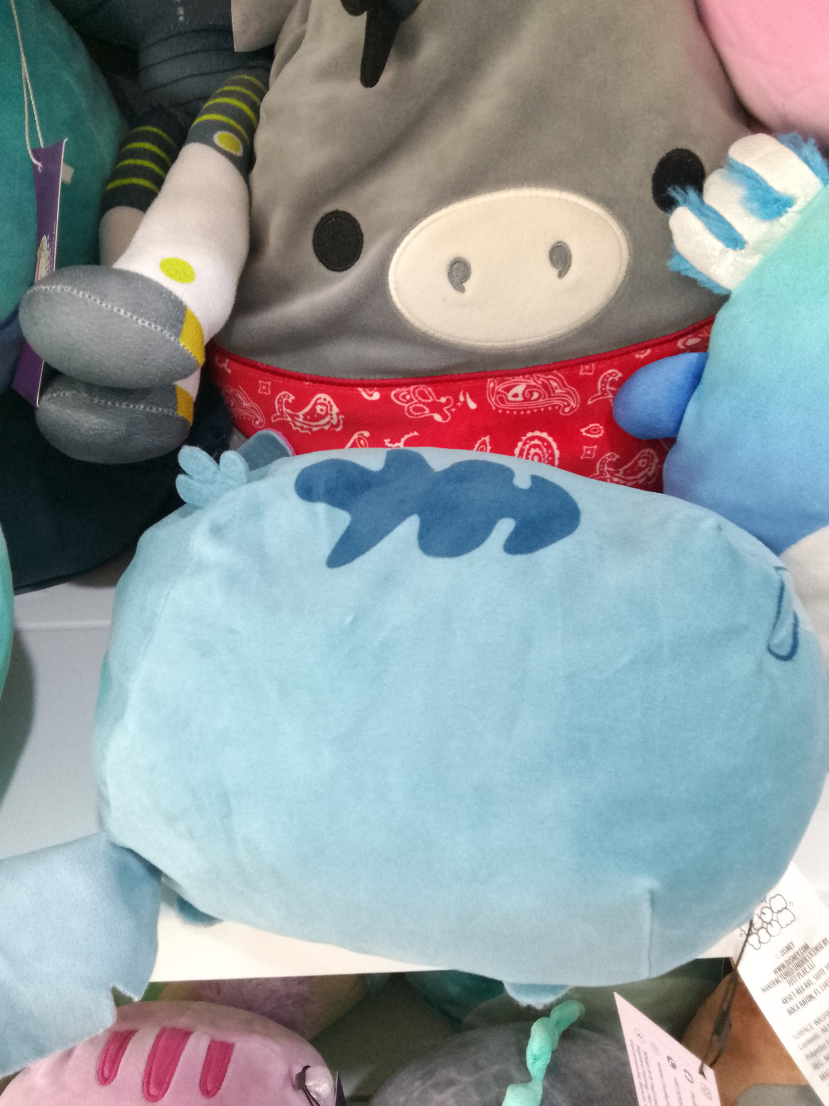 Disney Squishmallows plush toys featuring Stitch.