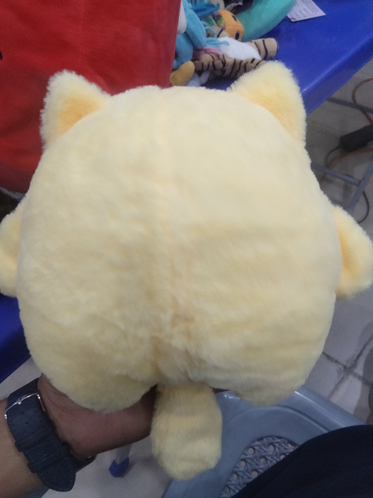 yellow Pompompurin Sanrio plush.