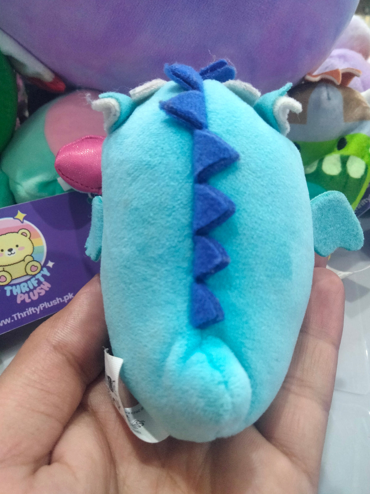 Squishmallows Tatiana Teal Dragon plush toy.