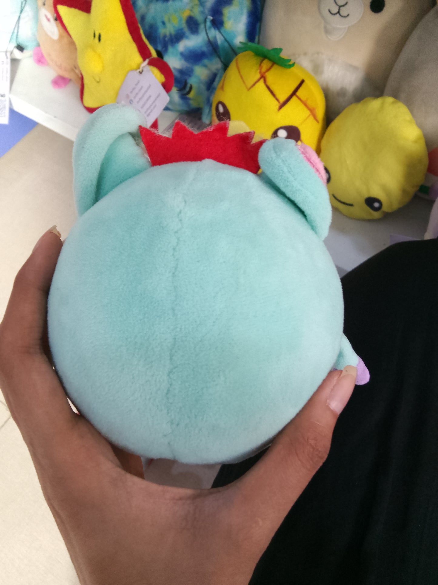 light blue Crunchimals Unicorn plush toy.