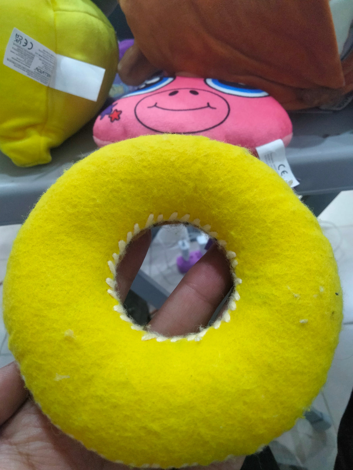 plush donut toy, often sold as a pet chew toy.