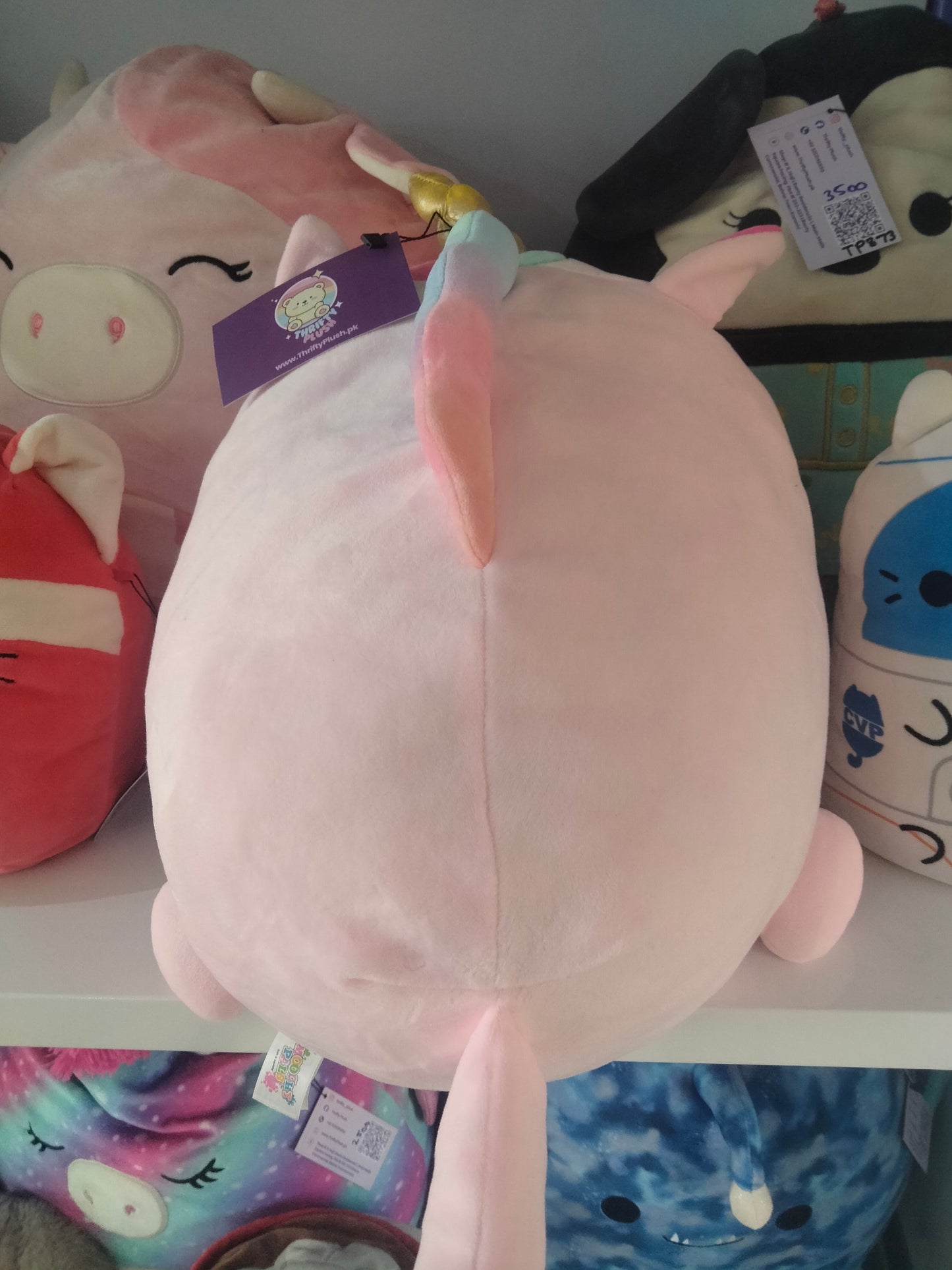 Large pink unicorn plush toy