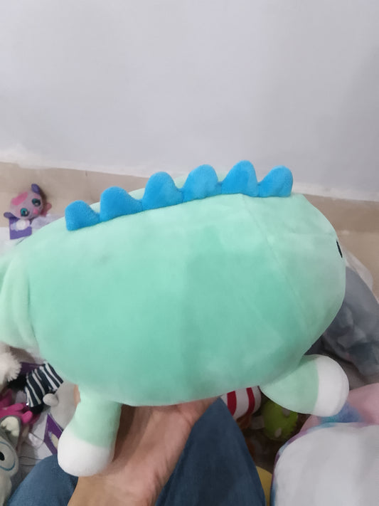 Squishmallows Rafa the Dinosaur Hug Mees plush toy in teal green.