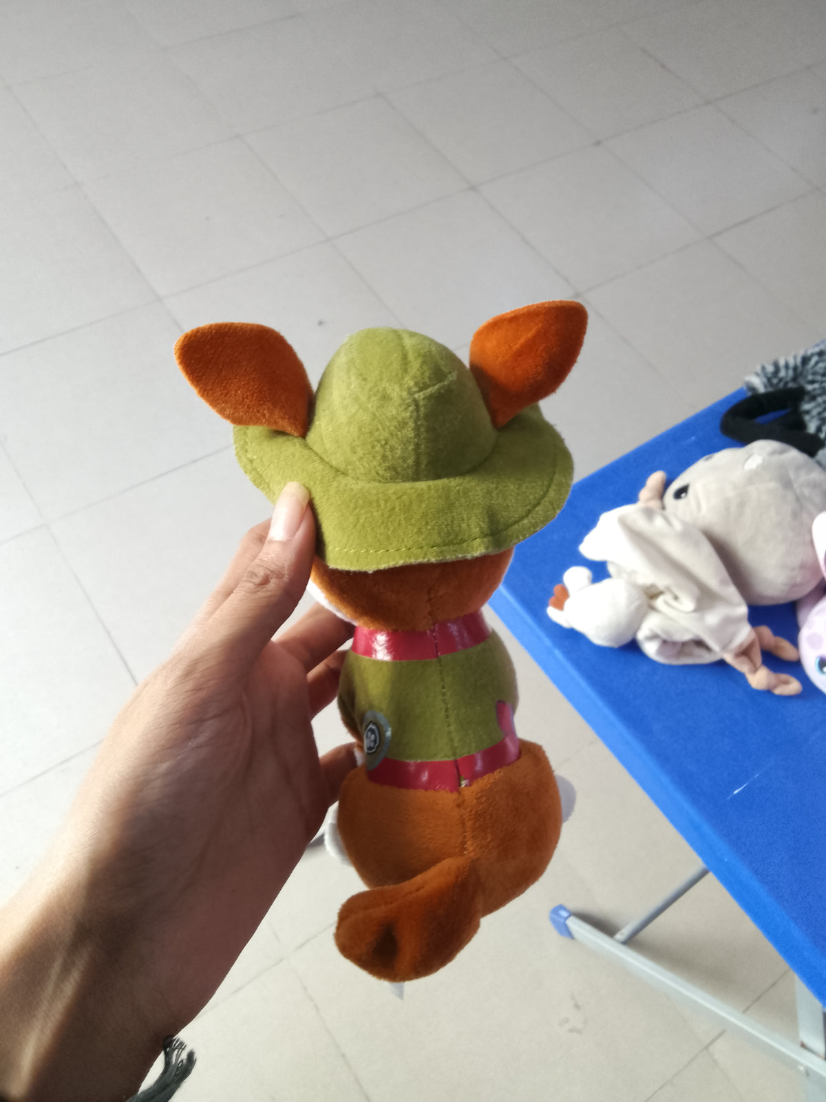 PAW Patrol Tracker plush toy featuring his signature green jungle hat and vest.