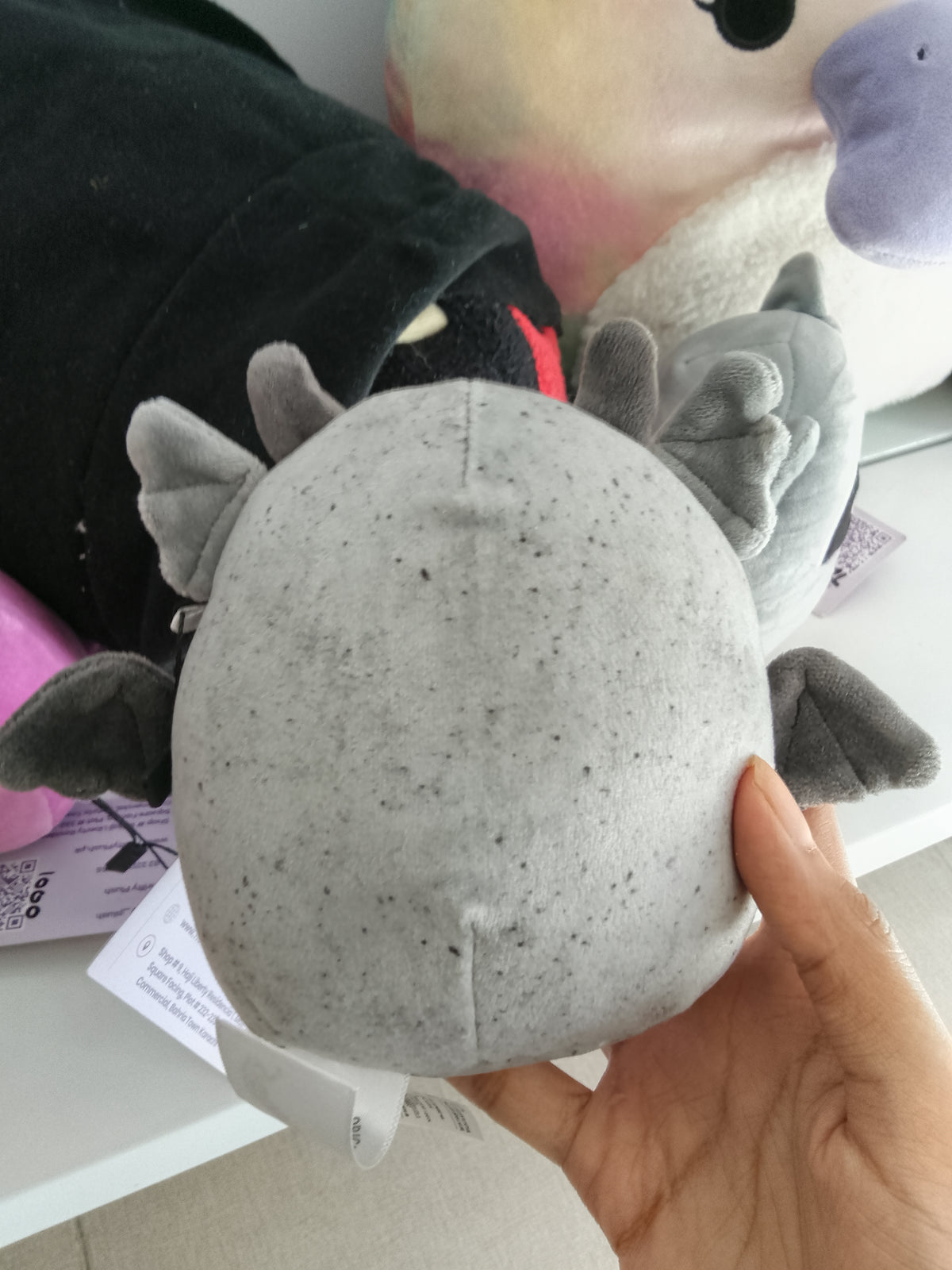 Squishmallows Halloween plush featuring Gio the Gargoyle in a speckled grey color.