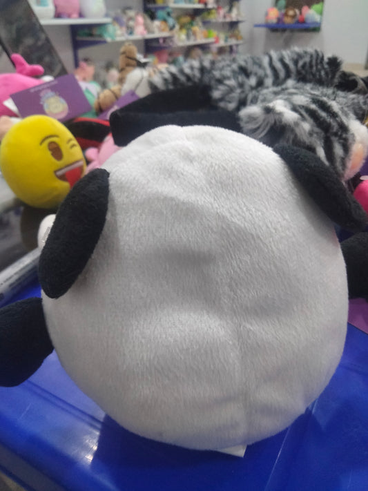 small round plush panda toy with blue eyes.