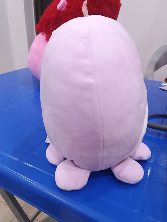 Squishmallows Violet the Octopus plush, recognizable by its light purple color, winking expression, and silver crown.