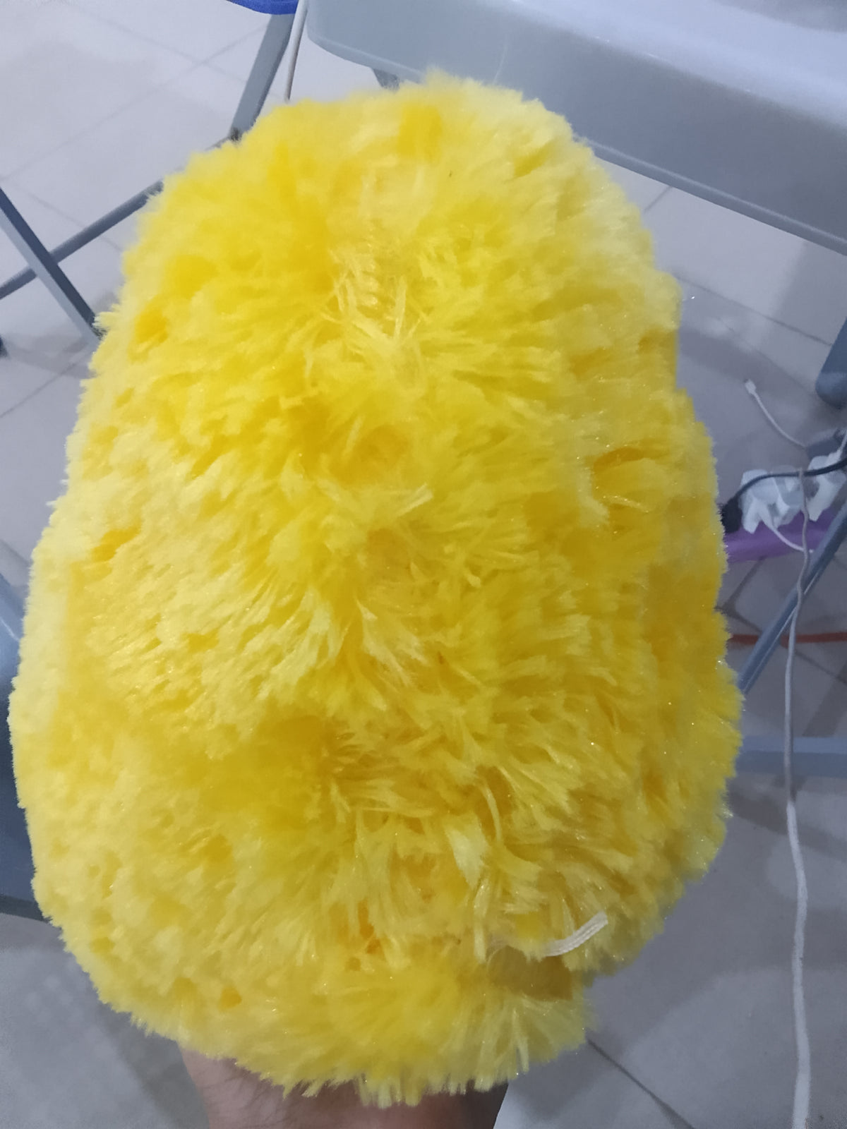 Nanco Belly Buddy yellow plush duck stuffed animal fluffy texture and orange beak and feet.