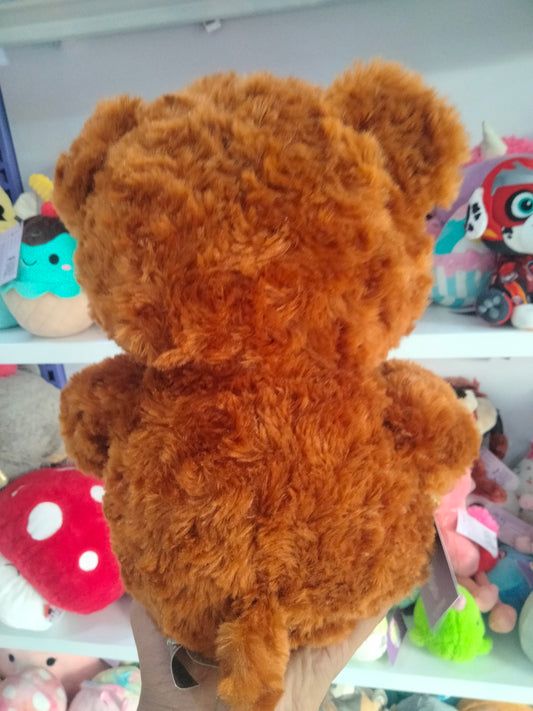 Brown plush teddy bear.