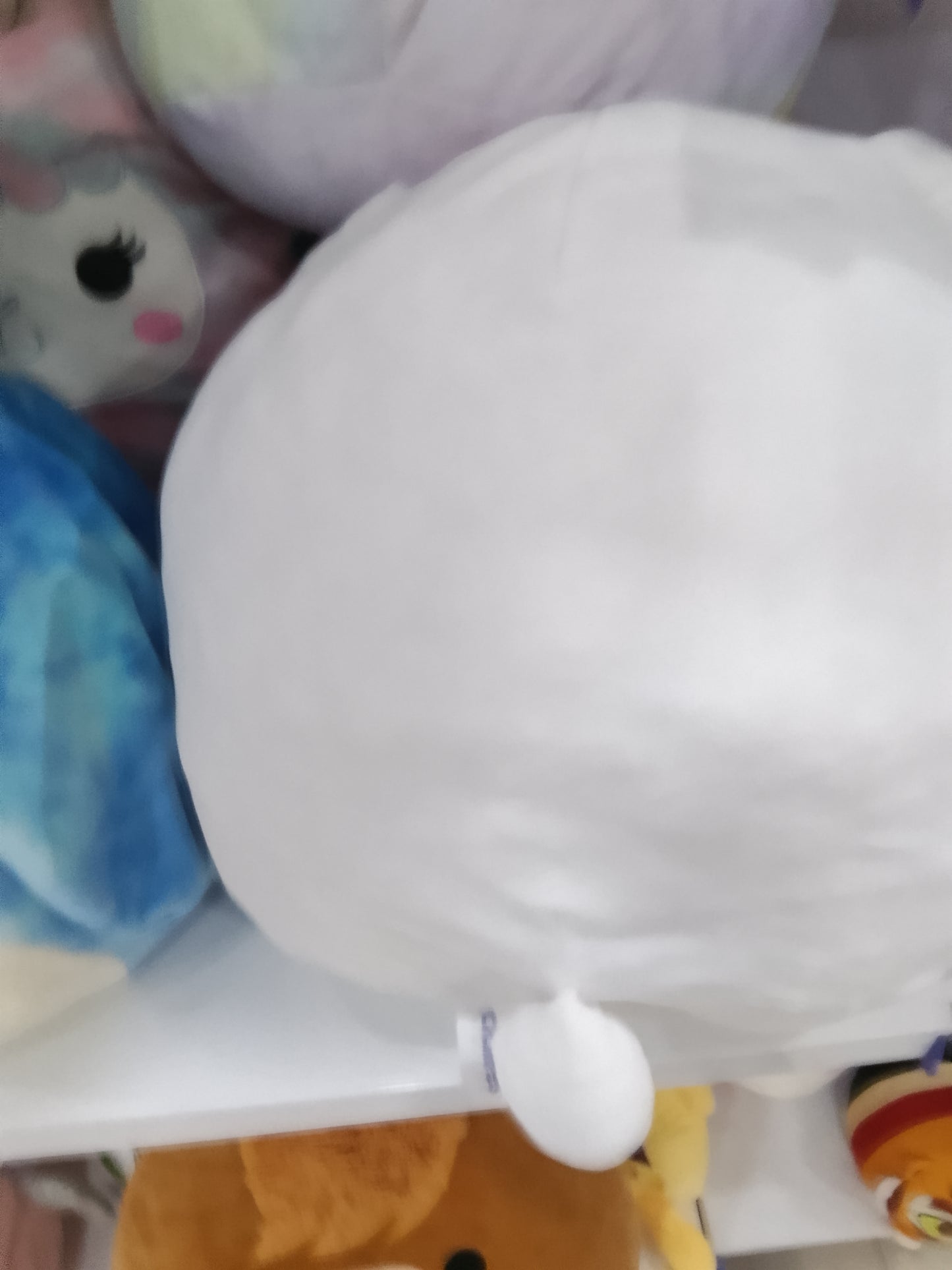 Squishmallows Lavada the Bunny plush toys, white bodies with pink and purple ombre patches on their ears and sides.