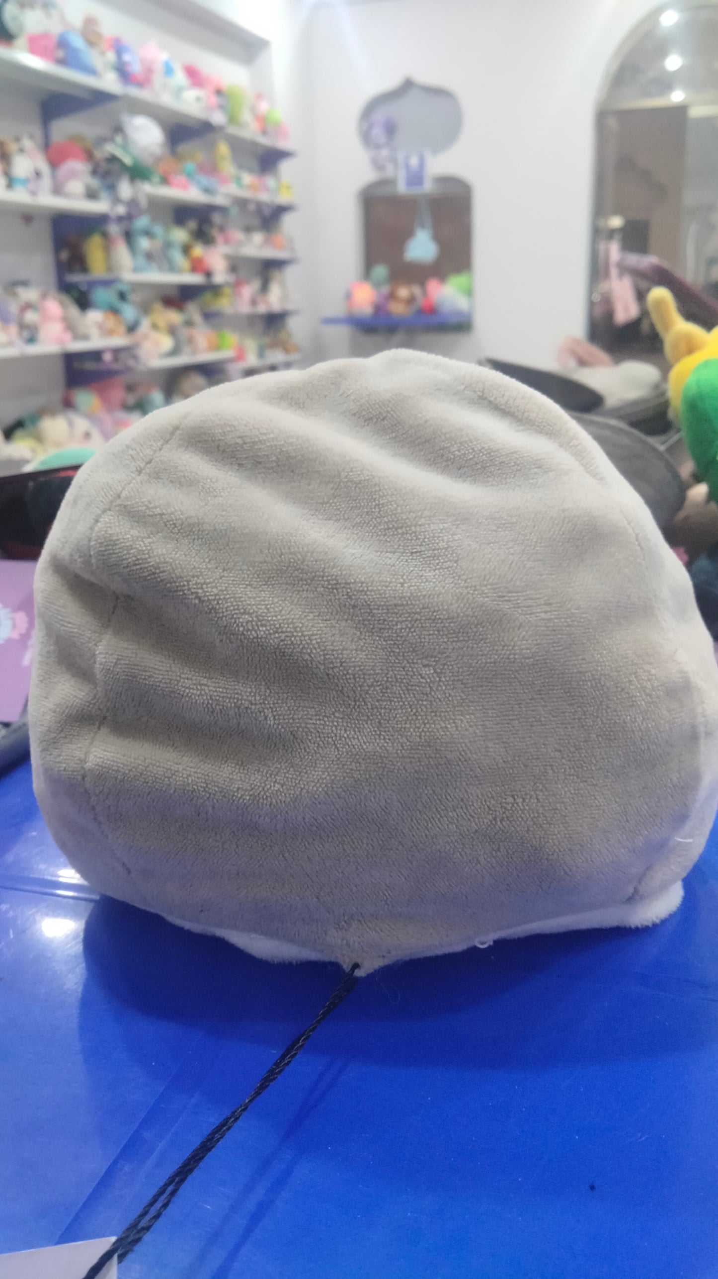 This is a reversible octopus plushie with an angry face on the grey side