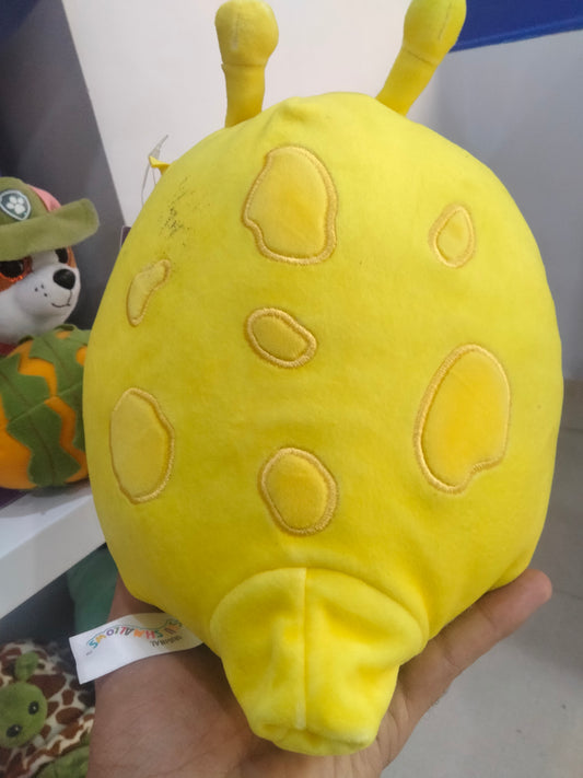 Squishmallows Zarina the yellow banana slug plush toy.