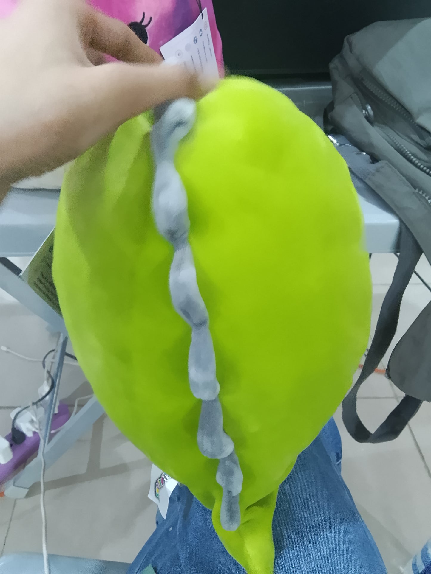 Squishmallows plush toy featuring Arlie the green dinosaur.