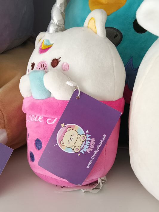 bubble tea cup featuring a unicorn character plush toy.