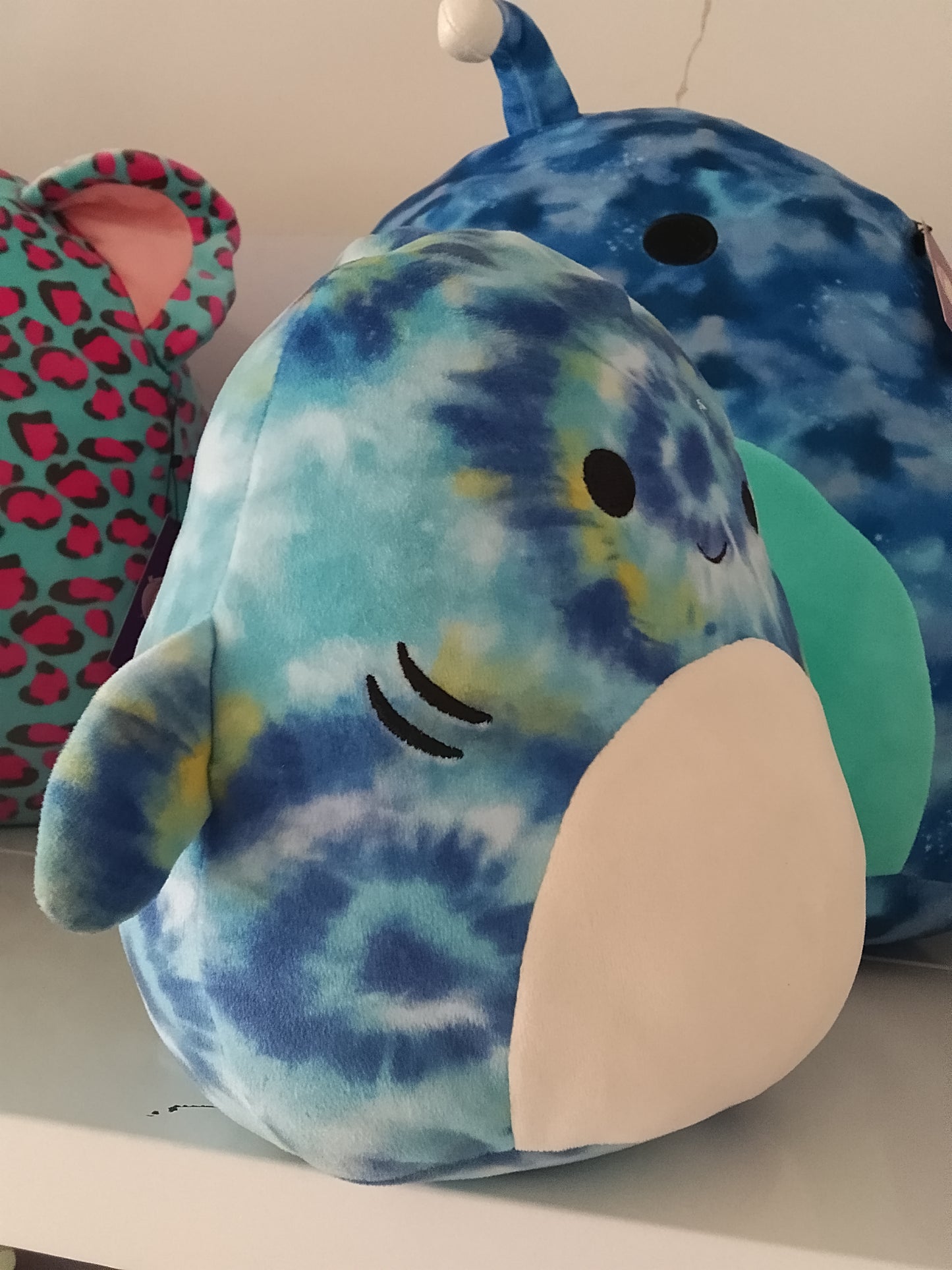 Squishmallows Luther the Blue Tie-Dye Tiger Shark plush toy.