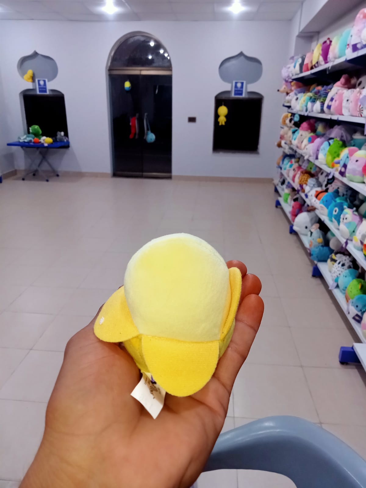 Junie the Banana, a popular character from the Squishmallows brand.