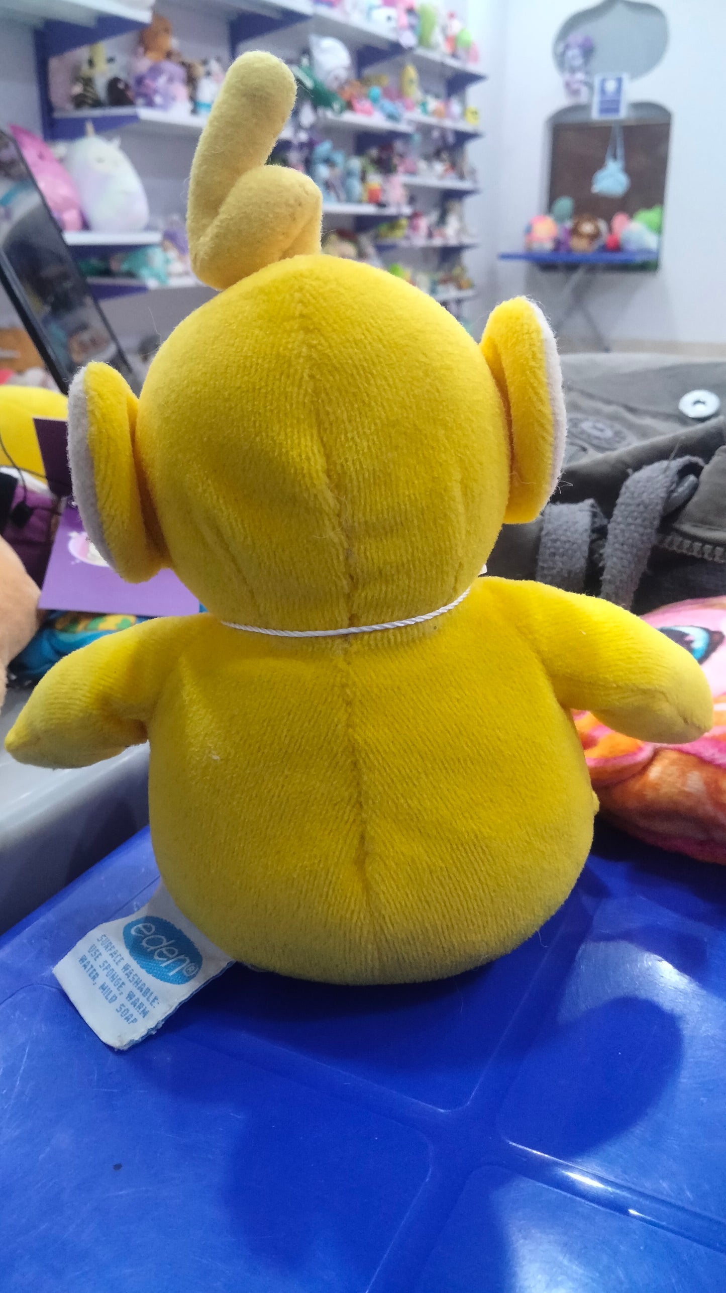 yellow Teletubbies Laa-Laa plush toy.