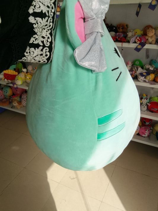 Squishmallows plush of Tres'zure the Cat, mint green color and a glittery silver bow