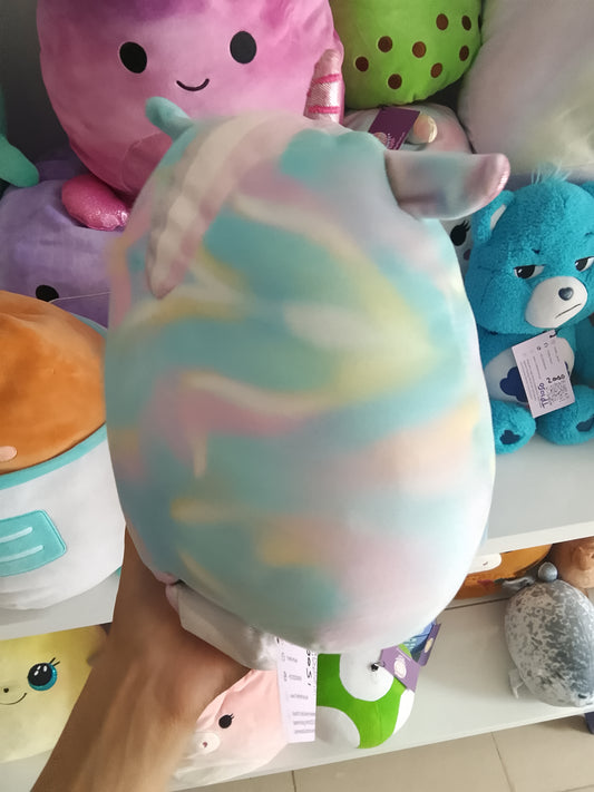 Squishmallows Kellytoys unicorn plush, possibly Rodina or Anouk Mystery Squad series, rainbow tie-dye pattern and a fluffy white belly.