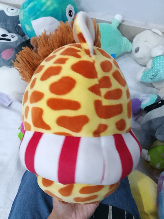 Kellytoy Squishmallows Gary the Giraffe plush red and white striped swimming inner tube.