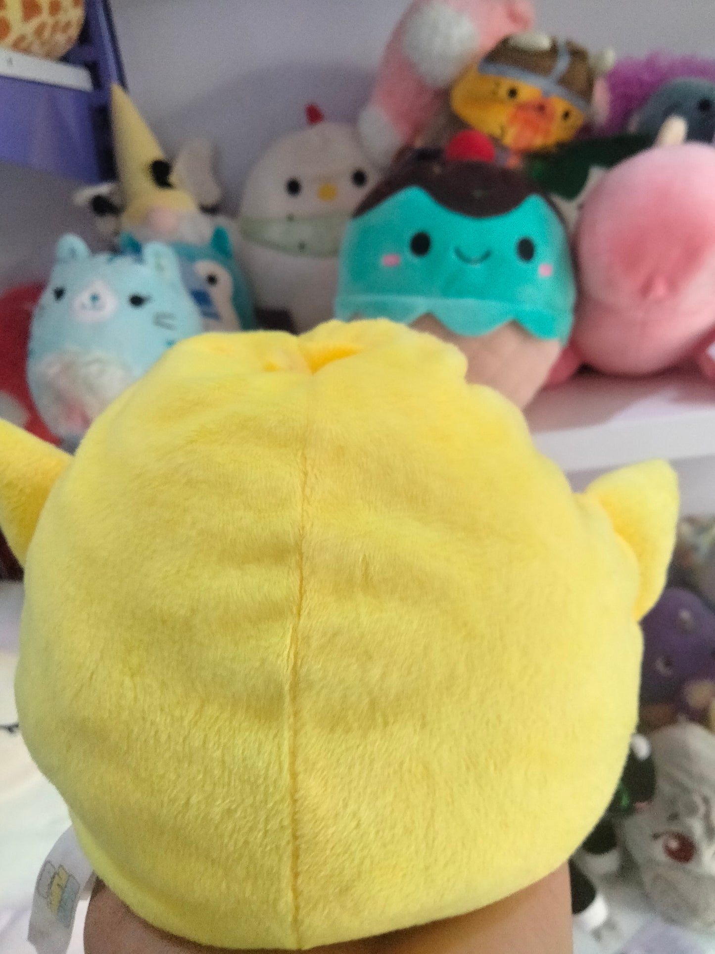 yellow Piu Piu stuffed animal plush toy by Aurora World.