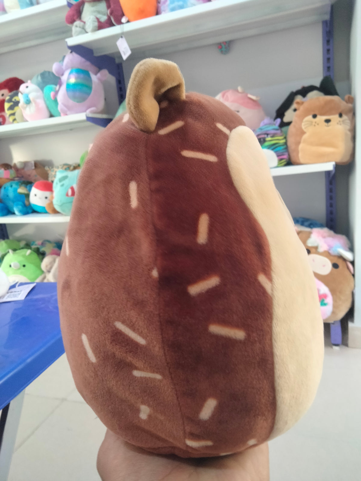Squishmallows Hans the Hedgehog brown plush toy.