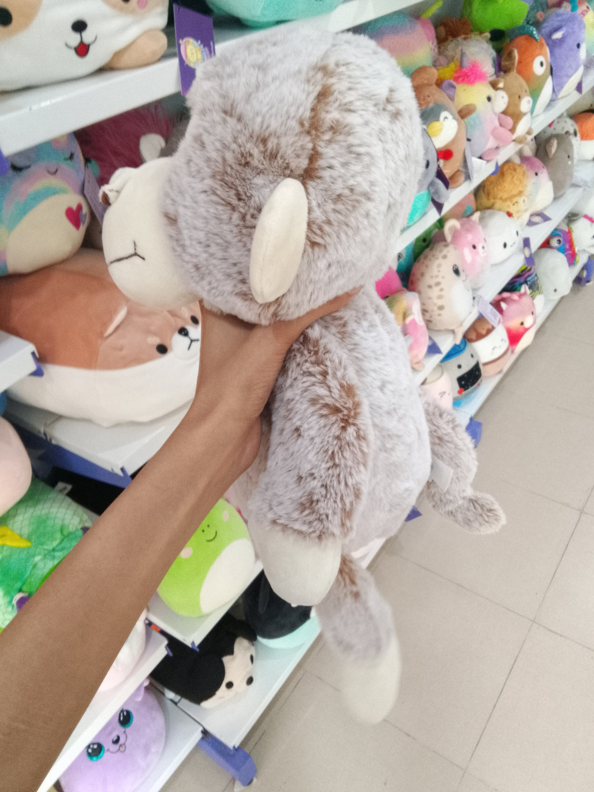 Kid Connection gray and white monkey plush toy.