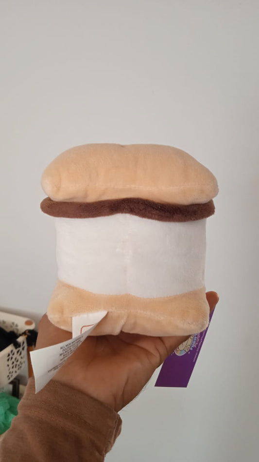 Palm Pals brand Aurora plush toy.