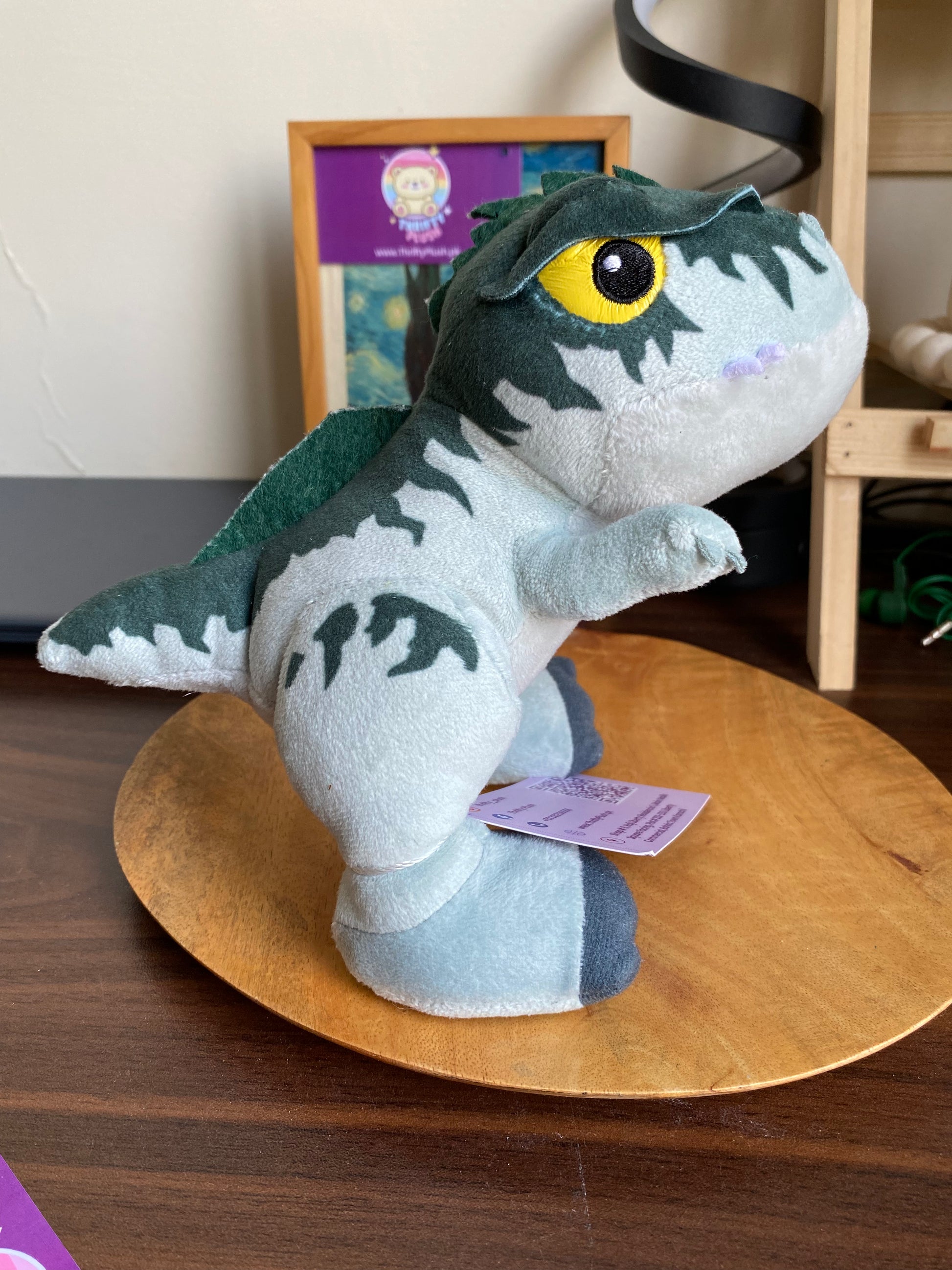 Jurassic World Velociraptor plush toy with yellow eyes – dinosaur stuffed animal in Pakistan