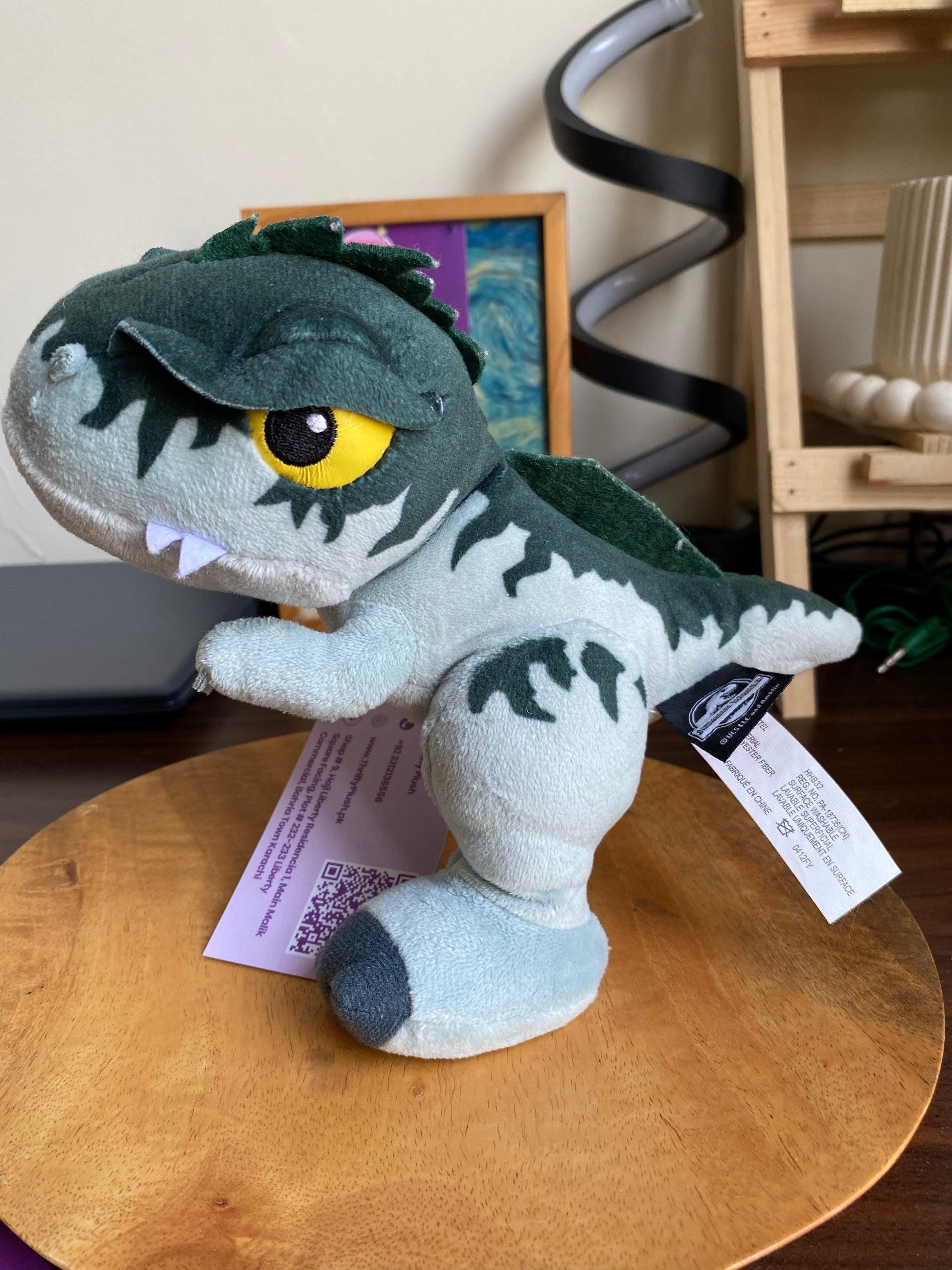 Jurassic World Velociraptor plush toy with yellow eyes – dinosaur stuffed animal in Pakistan