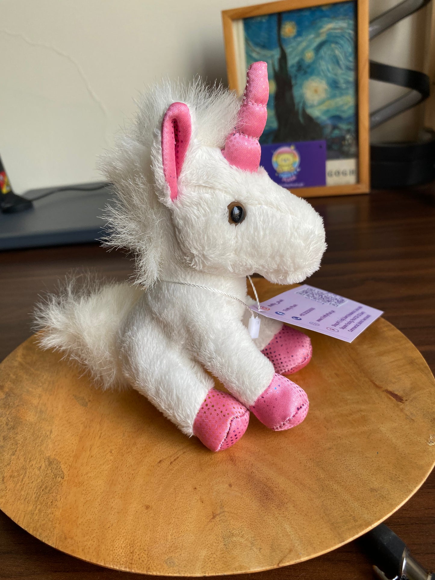 Image of a tiny white unicorn plush with soft snowy-white fur and a small horn, shown against a plain background.