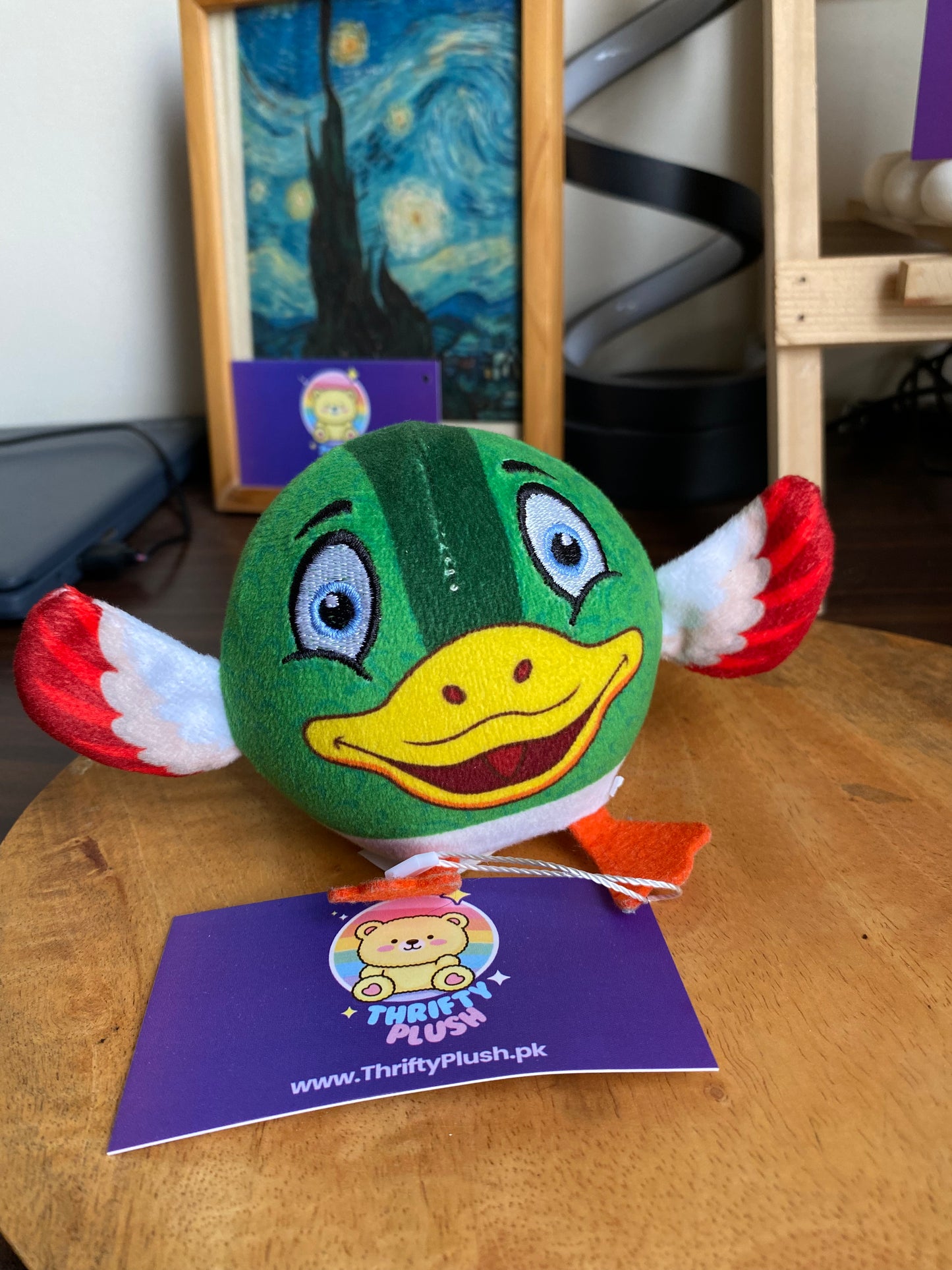 Round green duck squishy plush stress ball toy with yellow beak