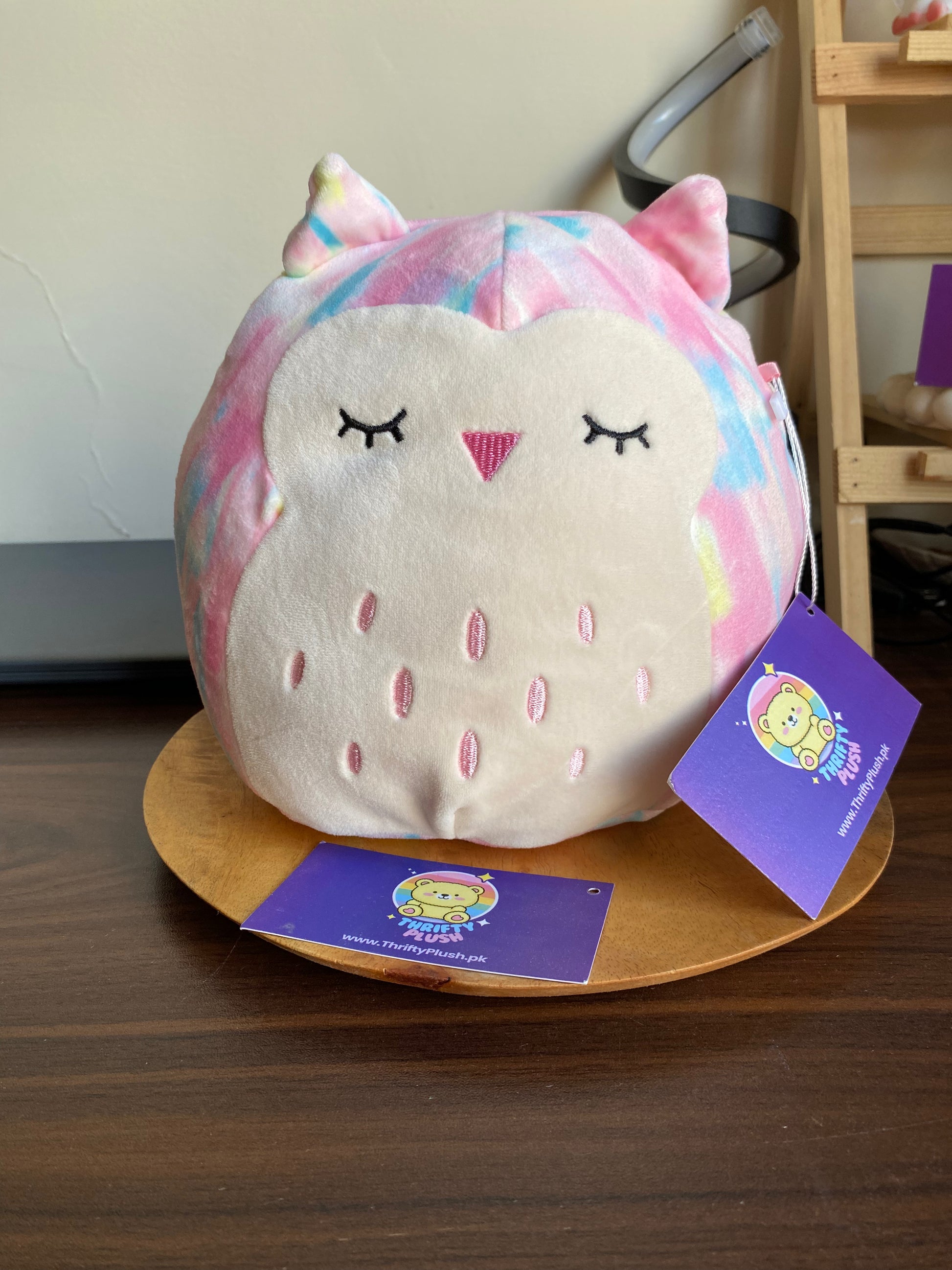 Squishmallows Lesedi Rainbow Owl plush toy, 7.5 inches tall, soft tie-dye pastel colors with big owl eyes and wings,