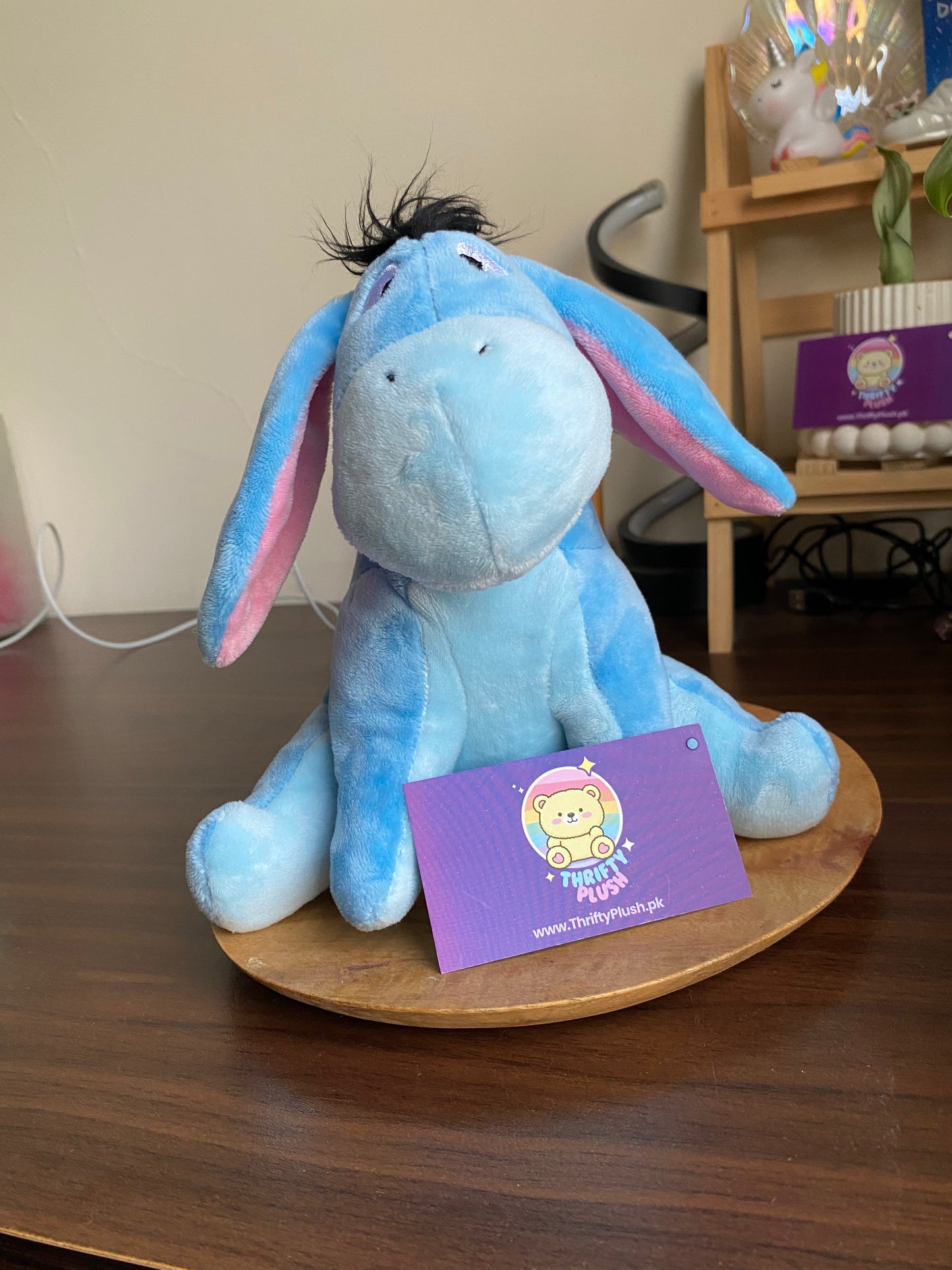 Blue Eeyore plush donkey toy with long floppy ears and fuzzy mane