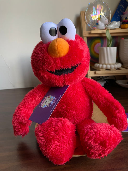Elmo plush toy red fuzzy Sesame Street stuffed toy with orange nos