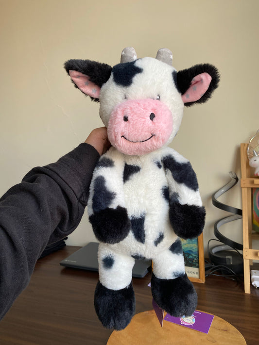 Black and white Worlds Softest Plush cow stuffed animal.
