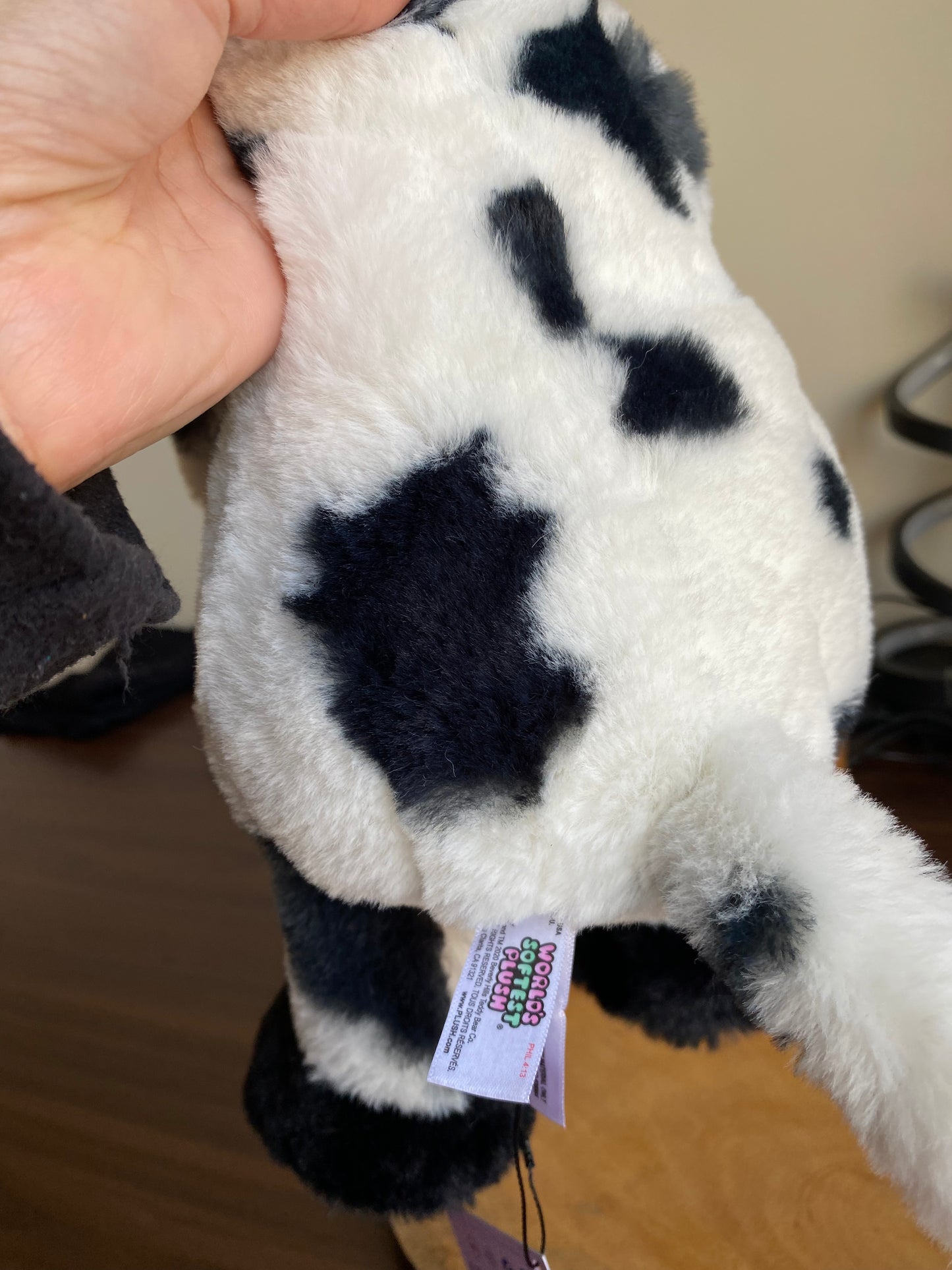 Black and white Worlds Softest Plush cow stuffed animal.