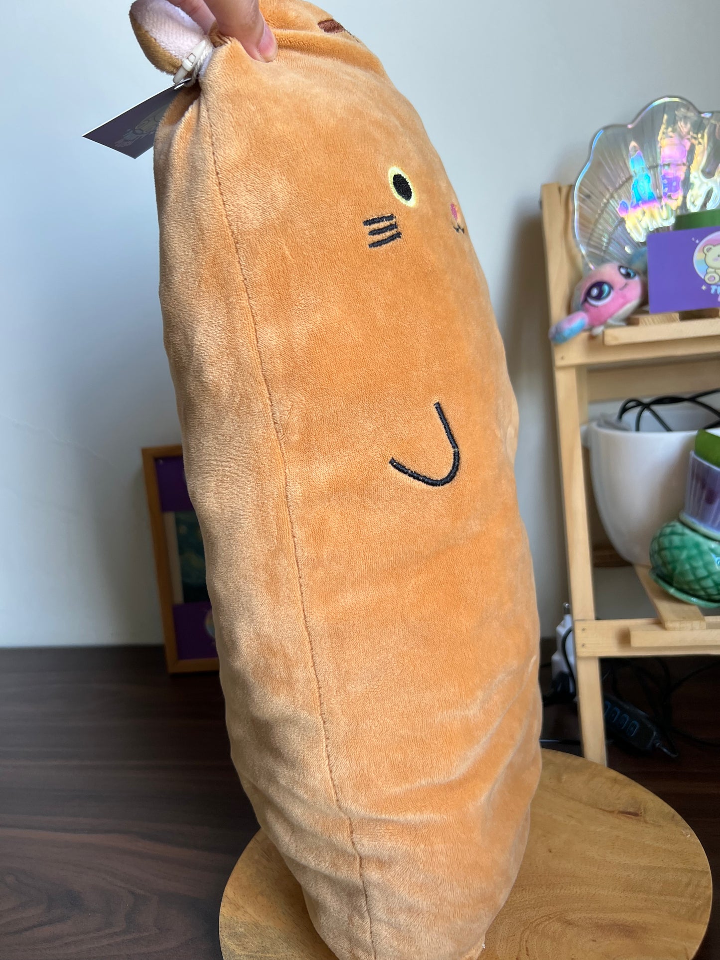 Orange Cat Plush Pillow With A Cute, Simplistic Face.