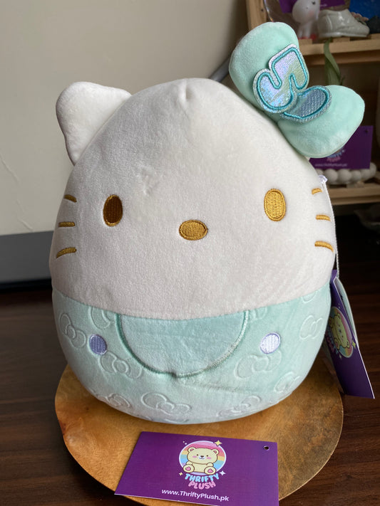 Hello Kitty 50th Anniversary Squishmallows plush toy with green bow and gold eyes – 8 inch collectible in Pakistan
